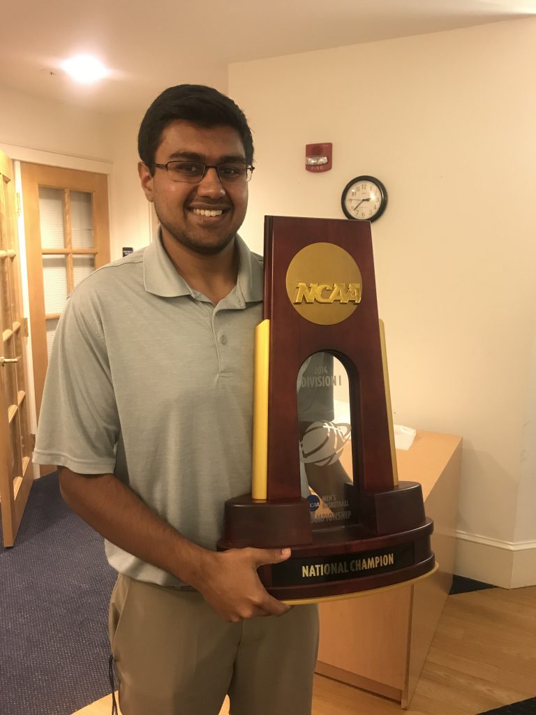 Aakash with a NCAA trophy