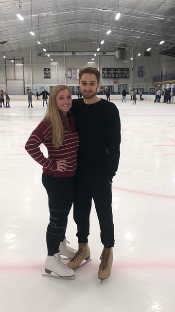 Christina with a friends at an ice skating rink